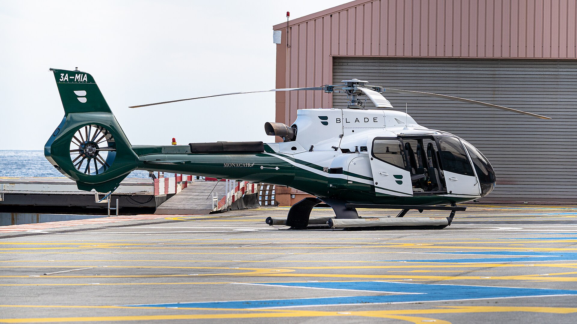 A Monacair helicopter on the pad at Monaco Heliport